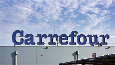 Carrefour lettering on a roof