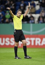 Referee Robert Hartmann gestures
