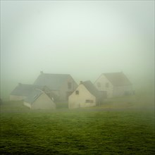 Houses of the faithrail of Brion in the mist in autum