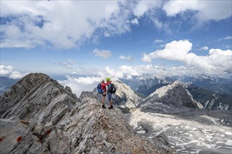 Young couple hugging at the summit