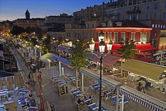 Evening hustle and bustle with restaurants and market stalls on the Cours Saleya