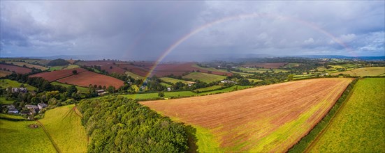 Rainbow over the Fields over Compton Castle from a drone