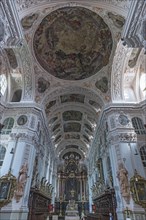 Baroque church room with altar and choir stalls