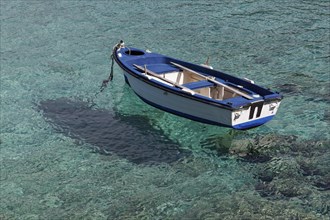 Rowing boat in crystal clear water