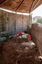 Cremation site of Gaius Julius Caesar with floral decoration at foot of Temple of Divine Divus Iulius