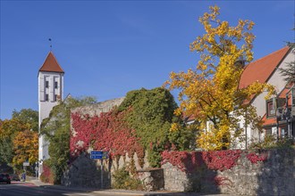 Waisentor and remains of the town wall with autumn leaves