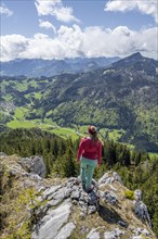 Hiker looking over the Chiemgau valley