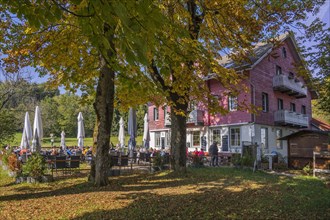 Restaurant and beer garden at Mariaberg with autumnal chestnut trees