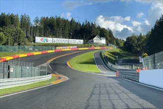 View from racing car on Eau Rouge bend and Raidillon slip road of Circuit de Spa-Francorchamps