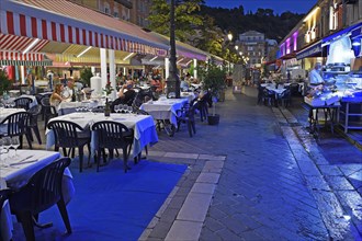 Evening hustle and bustle with restaurants and market stalls on the Cours Saleya