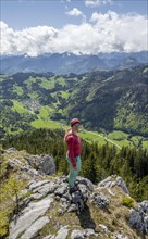 Hiker looking over the Chiemgau valley