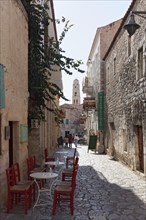 Romantic old town alley with alleyway cafe