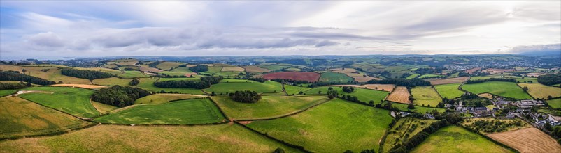 Panorama of Fields and Meadows over English Village from a drone