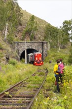Hikers and a railway on the old route of the Trans-Siberian Railway