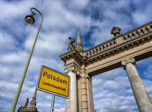 The colonnades with the Potsdam city entrance sign at the Glienicke Bridge