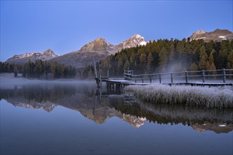 Mountain peaks reflected in Lake Staz