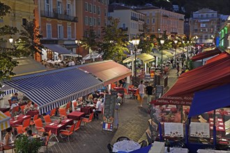 Evening hustle and bustle with restaurants and market stalls on the Cours Saleya