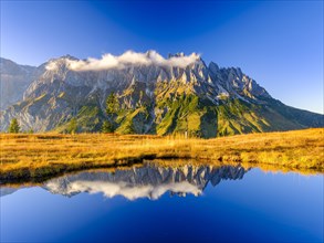 Mandlwaende reflected in a mountain lake
