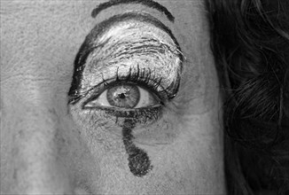 Woman with painted tear on eye