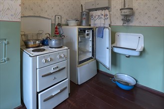 Kitchen with cooker and refrigerator from the 1950s