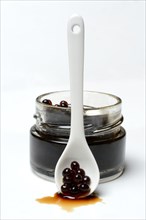 Aceto pearls in glass and spoon