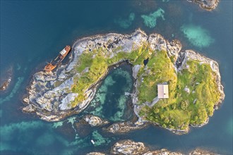 Small island and shipwreck along the Atlantic Strait