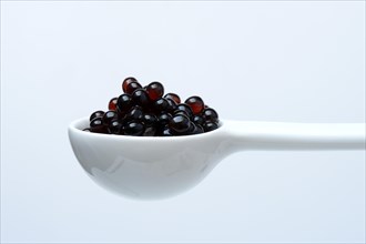 Aceto pearls in ladle