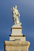 Statue of Madonna Mary Mother of God on Ramla Bay Beach