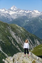 Young girl posing before the Swiss Alps