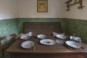 Dining table in a kitchen of a workers' flat around 1900