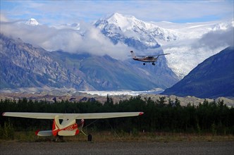Small planes and snow-capped mountains and glaciers