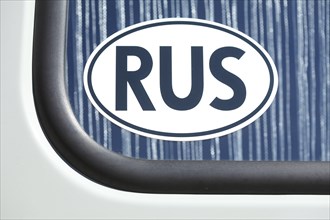 Russian car number plate on a car window