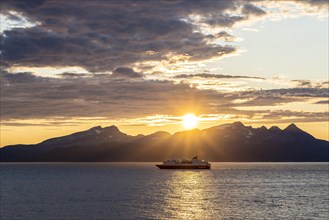 Hurtigruten ship at sunset