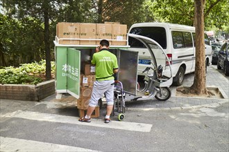 Supplier with small tricycle delivery vehicle