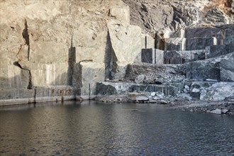 Disused marble quarry for green marble directly by the sea