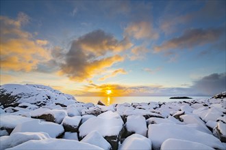 Sunrise on the snow-covered rocks