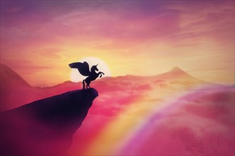 Wild pegasus silhouette on a cliff edge against a pink paradise sunset