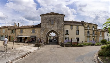 Access road and city gate of the historic old town of Monpazier