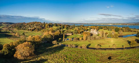 Panorama over Powderham Castle and Park from a drone in Autumn Colors