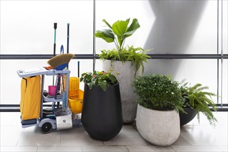 Cleaning trolley with broom and utensils