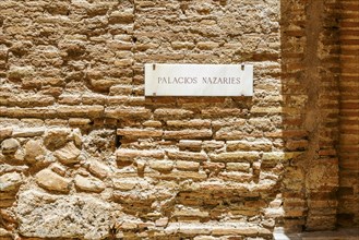 The sign saying Palacios Nazaries what translates to Nasrid palaces in Alhambra palace complex