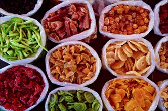 Plastic bags with dried fruits on market
