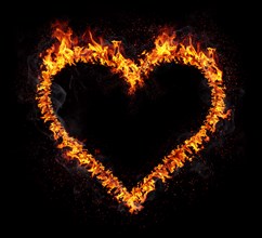 Flaming heart isolated on black background