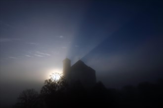 Silhouette of the pilgrimage church Marienberg at sunrise