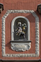 Sculpture with cornucopia in a niche on the facade of the Mohrenapotheke since 1890
