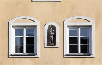 Niche with figure of a saint on a historic facade