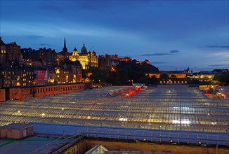 Large glass roof and building in the blue hour