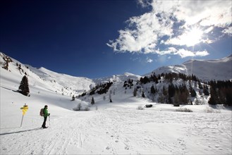 Woman on snowshoe tour at Lake Obernberg