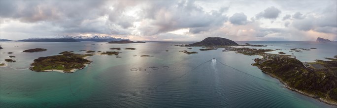 View over the sea with fish farms to Baltsfjorden and the mountains of Balten