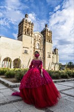Beautiful dressed girl before the Church of Santo Domingo de Guzman
